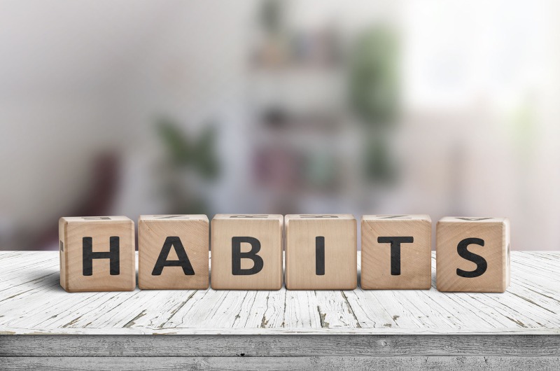 the word habits spelled out using wooden blocks